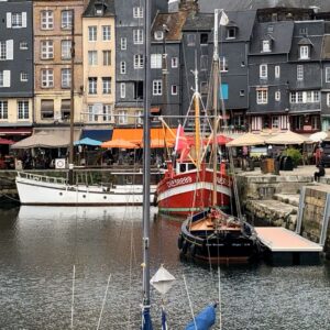 photo reference for paint-along of boats in the harbor with buildings behind in Honfleur, France