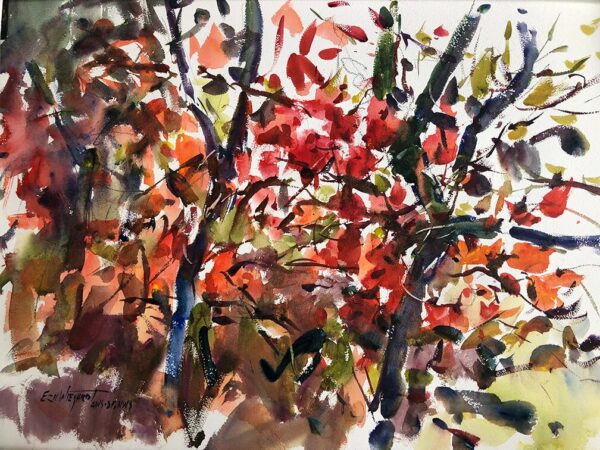 A dynamic and abstract watercolor painting of a tree. The artist has used a range of vivid colors, including reds, oranges, and deep greens, to represent the leaves, with dark blue and brown strokes for the branches. The painting has a sense of movement and energy, with expressive brushstrokes and splashes of color.