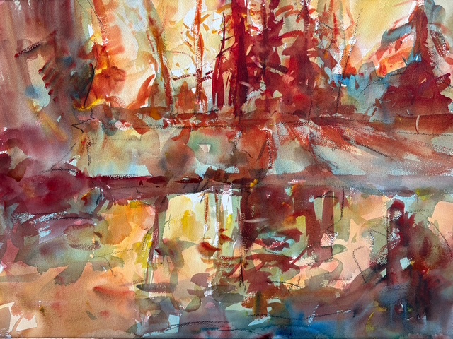 An abstract watercolor painting in warm autumn tones of red, orange, and gold, depicting a dense forest reflecting across a calm body of water.