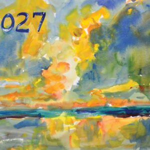Watercolor calendar cover for 2027. The year appears in bold navy hand-lettered numerals in the upper left corner. The painting depicts a dramatic landscape with a radiant burst of golden-yellow and orange light at the center — suggesting a sunrise or sunset — surrounded by soft blue-green trees on both sides. The warm light reflects in loose, expressive strokes across a teal and blue body of water in the lower half of the composition.