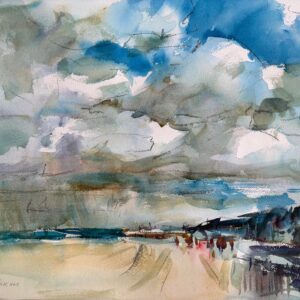 A wide beach under a dramatic sky filled with layered blue, gray, and white clouds. Small figures walk along pale sand toward distant buildings at the right, with a strip of teal sea on the horizon.
