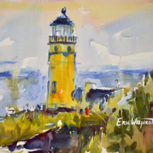 A tall yellow lighthouse rises above windswept dune grass, its lantern room catching warm light against a hazy blue-and-peach sky, with the ocean and distant headland visible beyond.