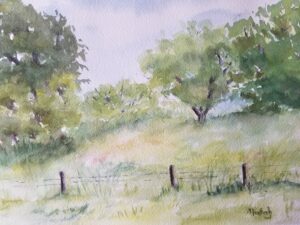 A scene of a sunny summer afternoon in the country.