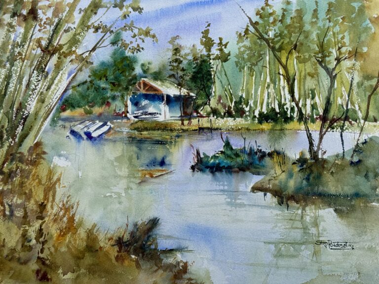 Country Pond, original watercolor painting of a pond with a building with boats on the shore and lots of hard wood trees and some evergreens, all in blue, green and tan coloring.