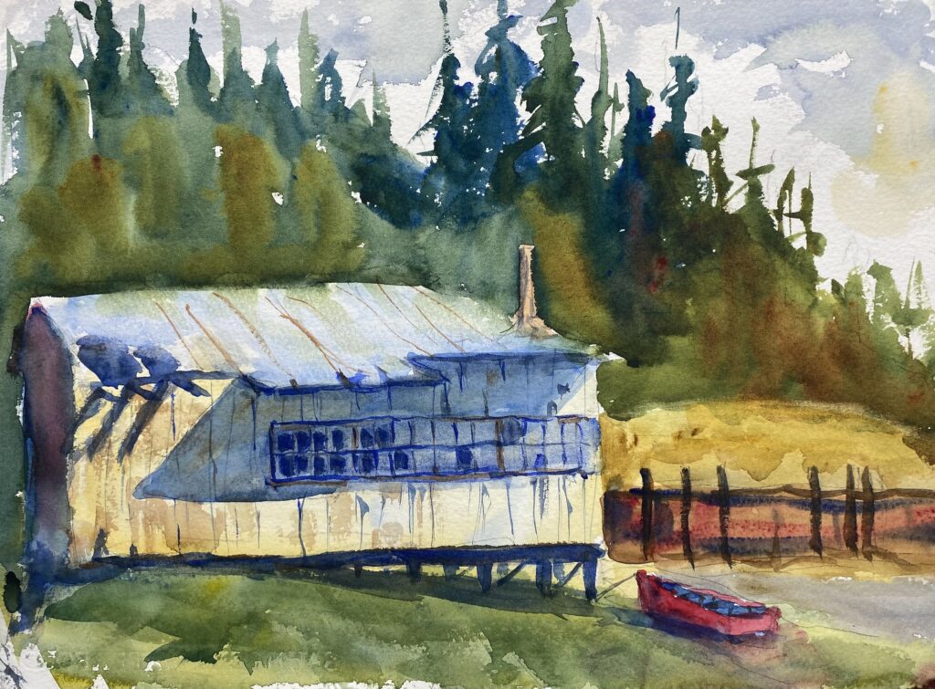 Shelton Boatshed, original watercolor painting of an old white boatshed with a red dingy out in front. The water has receded from the front of the shed. There are evergreen trees on the hillside on the far side of the shed.