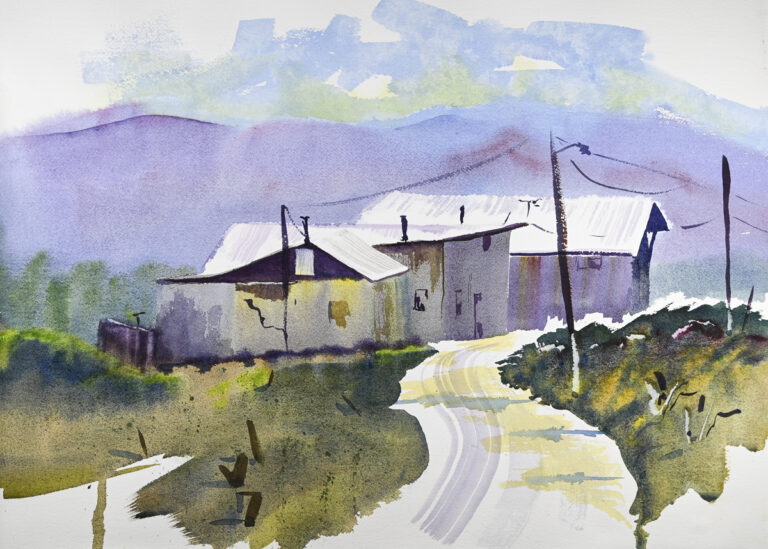 Truchas Vista, original watercolor painting of three white buildings. There is a white road running in front and green grass covering the ground around and purple hills behind.